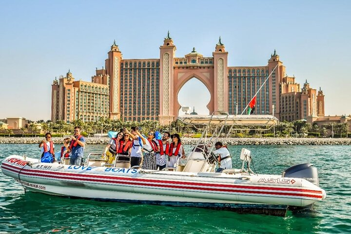 Experience the stunning Dubai skyline from the water as you glide past the iconic Atlantis resort creating unforgettable moments with every wave during your private speedboat adventure.